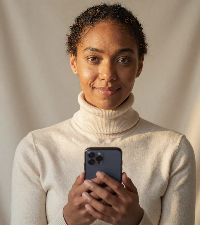 BBC singles dating member Naomi completing liveness-detection verification on the xl dating site, warm editorial portrait